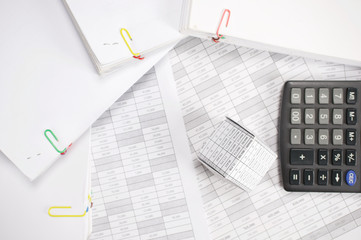 Naklejka na ściany i meble House with blur calculator and stack paperwork on finance account