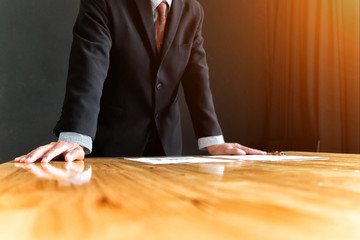 businessman in suit looking and tink vision of business in office