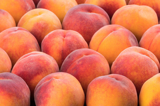 Ripe peach fruit background, close up.