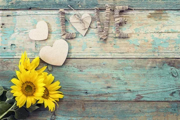 Photo sur Plexiglas Tournesol Background with  sunflowers, hearts and the word love on old woo