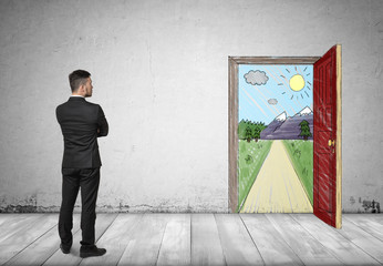 Obraz premium Back view of businessman looking at open door with hand drawn sunny mountain landscape and road