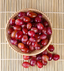 grape isolated on wooden background.
