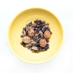 Dried Fruit Seeds and Nuts in Yellow Porcelain Bowl