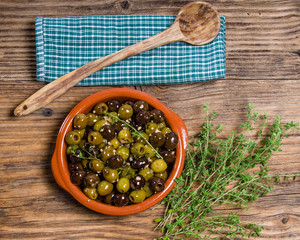 Bowl of olives with thyme