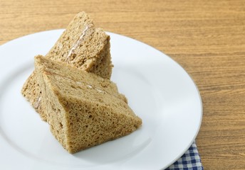 Triangle Coffee Chiffon Cake on A White Dish