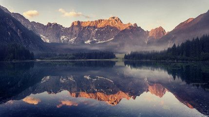 Fototapeta na wymiar mountain lake in the Ita lian Alps,retro colors, vintage