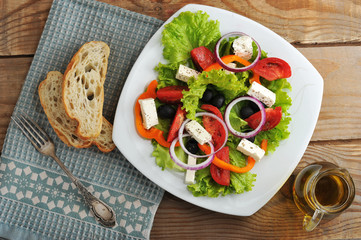 salad with feta cheese, black olives with onions and peppers and