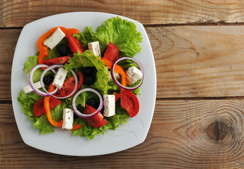 salad with feta cheese, black olives with onions and peppers and
