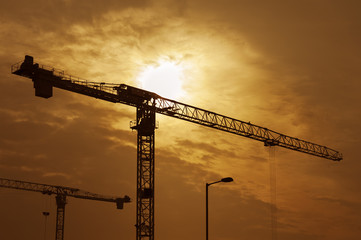 Crane in Construction Site under Sunset