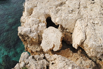 extremely weathered sandstone / cracked rocks on the coast of Cyprus