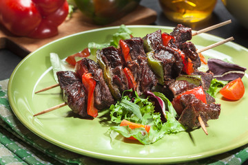 Grilled beef meat and vegetable kebabs