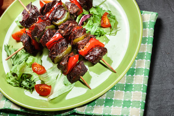 Grilled beef meat and vegetable kebabs