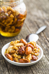 Honey and nuts in bowl.