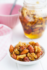 Honey and nuts in bowl.