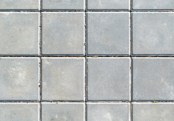 Surface of the gray square concrete slabs