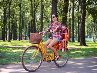 Active leisure activity of young mom and her son in summer