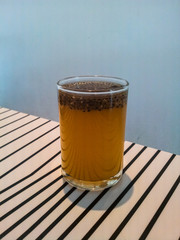 Full glass of orange juice with chia seed