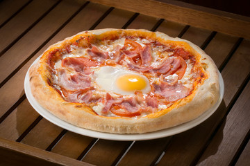 hot fresh pizza on a wooden table