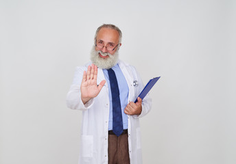 Mature doctor showing deny gesture