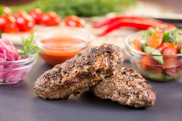lula kebab of beef with vegetables and ketchup