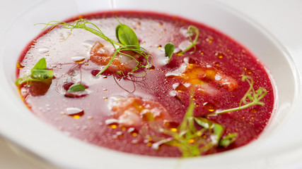 Spanish cuisine. Cherry gazpacho with prawns