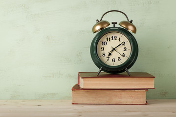 Alarm clock on books