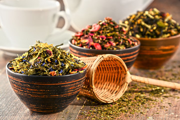 Composition with bowls of tea leaves