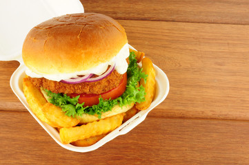 Chicken Sandwich And Fries In Take Away Box