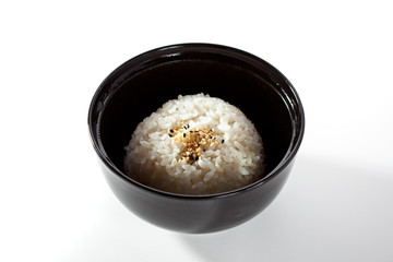 Black Bowl of Cooked Rice over White
