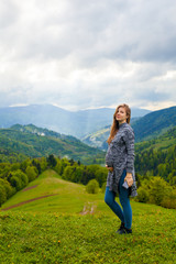 Beautiful view from mountain with pregnant woman on the foregrou