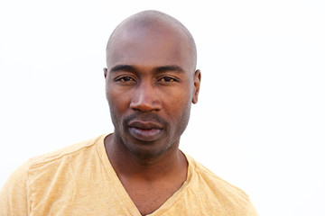 Young black guy against white wall