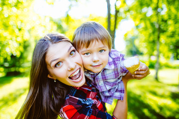 Mother and son happy in the park.Mother and Son Having Fun
