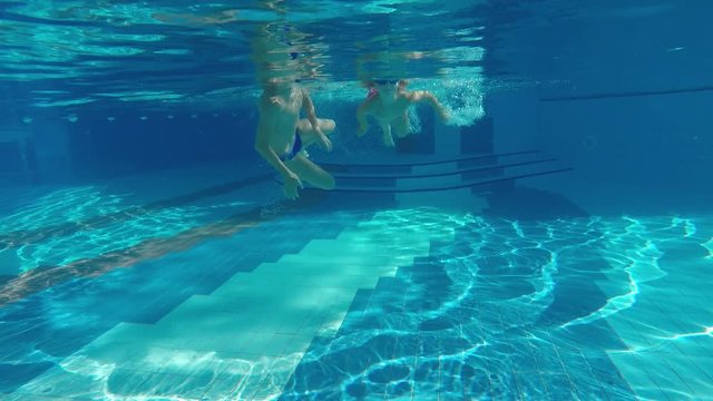 children swim in the pool