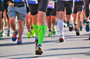 Marathon running race, runners feet on road, sport, fitness and healthy lifestyle concept
