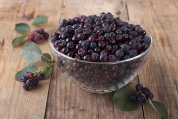 Shadberry in a glass bowl on the old wooden table