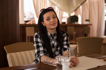 The woman is in a cafe
