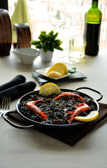 paella of rice black with Squid