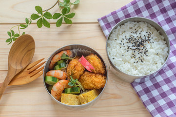 a colorful and tasty looking bento (a lunch box)