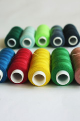 Bobbins of color thread