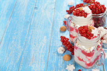 Dessert with red currant and whipped cream