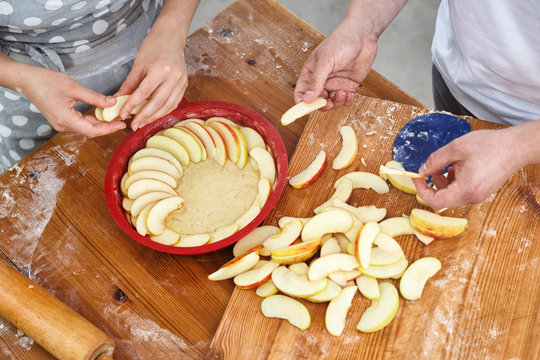 Young Couple Baking Yeast Cake
