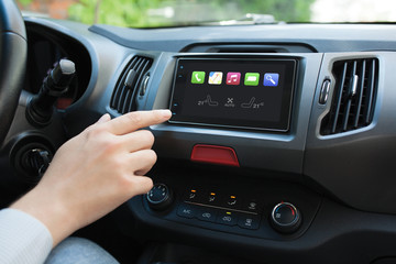 Man hand touching to screen multimedia system with Auto Play