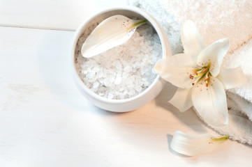 Obraz na płótnie Canvas Accessories for bath decorated with white lily