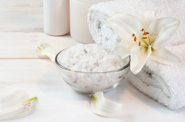 Obraz na płótnie Canvas Accessories for bath decorated with white lily