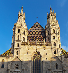Obraz premium Austria. Vienna. Gothic spiers and a fragment of the facade of St. Stephen's Cathedral in the sunset light (Stephansdom)