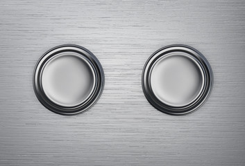 Two buttons on a metal background