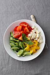 Fresh salad with feta on plate