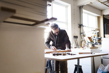 Carpenter working in workshop