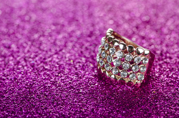 Jewellery ring against shiny background