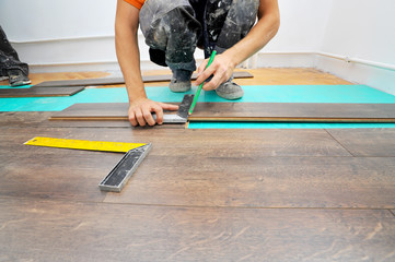 Carpenter doing laminate floor work